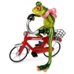 Frø hende på rød cykel